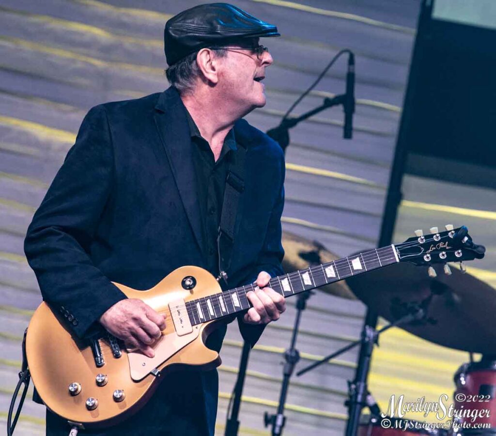 Al Orlo performing live with gold Les Paul